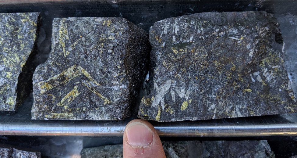 Drill core from the Farellon Vein showing late chalcopyrite mineralization replacing bladed actinolite.